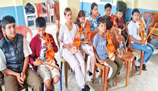 Syangja children learn sarangi from elders