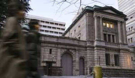Bank of Japan hikes inflation forecast, holds interest rates