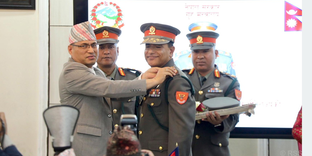 Home Secretary presents insignia to IGP Poudel
