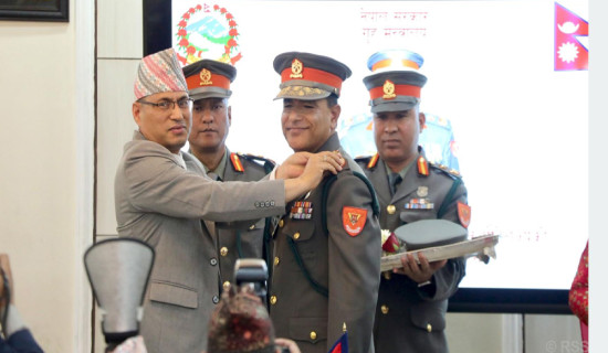 Home Secretary presents insignia to IGP Poudel