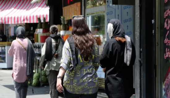 Iran summons news agency editor over photos of woman without hijab