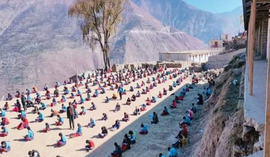 Students in Bajura take exams out in the sun