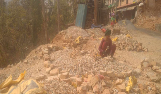 Women worker helps on gravel crushing in Jajarkot