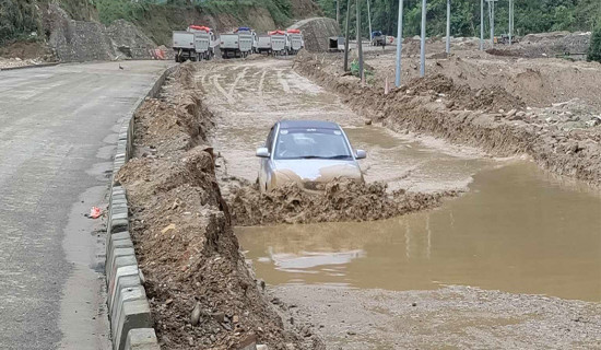 Car plying muddy road in Tanahun