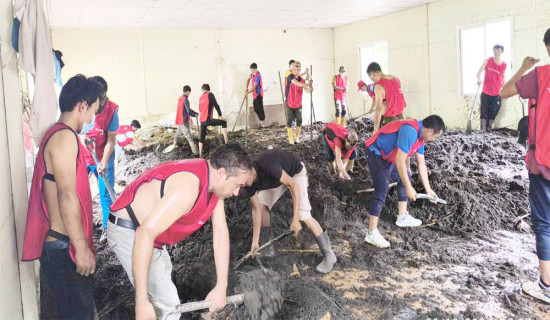 YCL volunteers clear  landslide debris