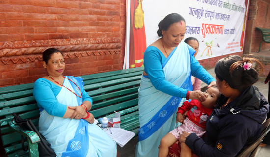 Vitamin A, de-worming tablets being administered to children