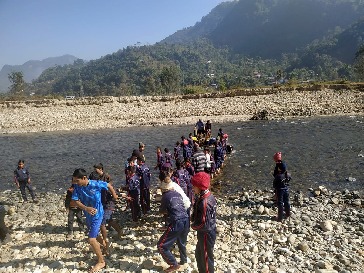 Temporary bridge being built over Aandhikhola River