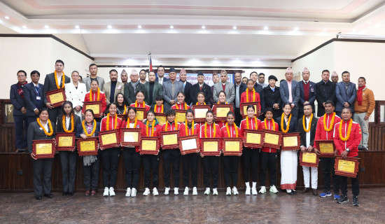 PM Oli hands prize to medal winning players of int'l sports championship