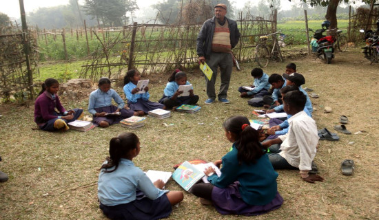 Students studying while sun-basking