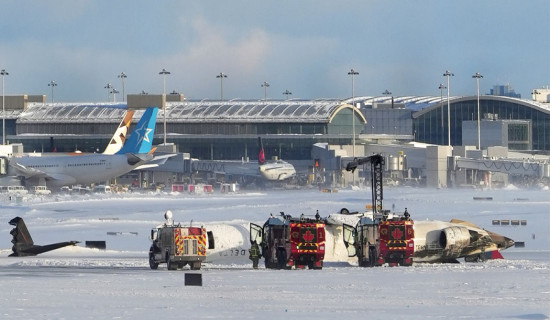 Jet flips on snowy Toronto runway