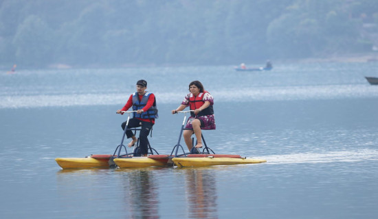 Tourists enjoying cycle boat in Pokhara