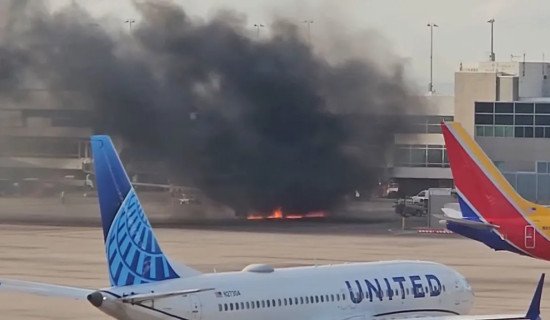 Passengers evacuate onto wing of American Airlines plane after engine catches fire