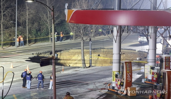 Motorcyclist swallowed by sinkhole in South Korea found in cardiac arrest