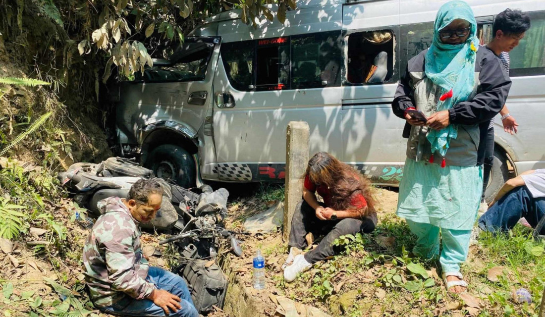 Two dead, 14 hurt in microbus-scooter collision
