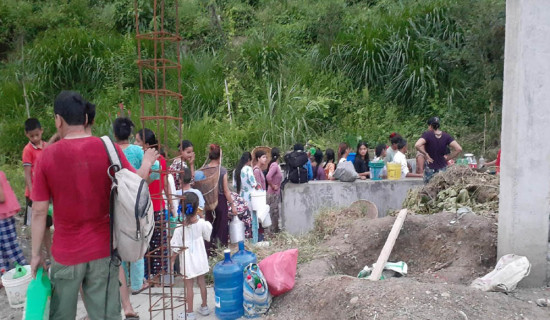 Hours in queue for a jar of water in Damauli