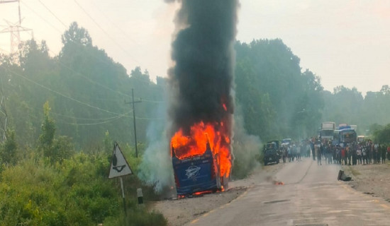 Running passenger bus catches fire