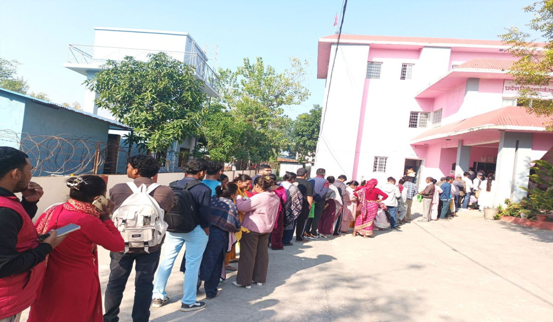 People wait for turn to register names in voter list