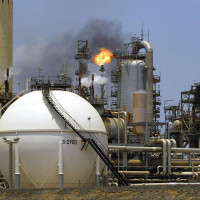 13 dead after landslides  bury 40 homes in Uganda