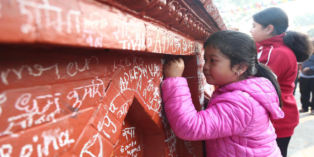 Akshararambha ritual during Saraswati Puja (Photo Feature)