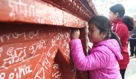 Akshararambha ritual during Saraswati Puja (Photo Feature)
