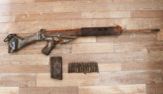 Fishing net catches gun, bullets in Phewa Lake