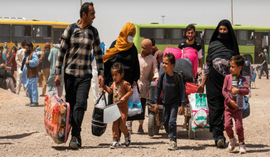 An Afghan family returns home from Iran after crossing the Islam Qala border in Afghanistan's Herat province in July 2025.  © UNHCR/Oxygen Empire Media Production