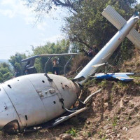 Two injured after falling from steep slope