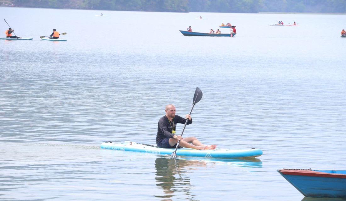 Tourists enjoy boating in Phewa Lake