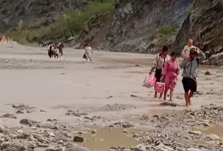 Traffic halted as April flood swipes away road